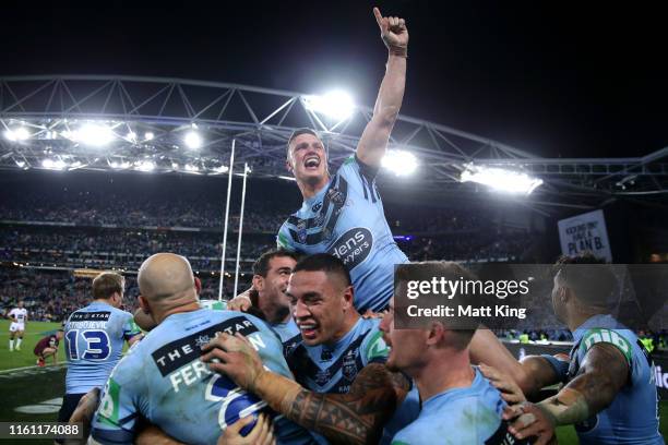 Jack Wighton of the Blues celebrates with team mates after winning game three of the 2019 State of Origin series between the New South Wales Blues...