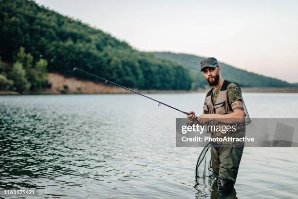 Man Getting Fish Fishing Man Isolated Photos and Premium High Res Pictures - Getty Images