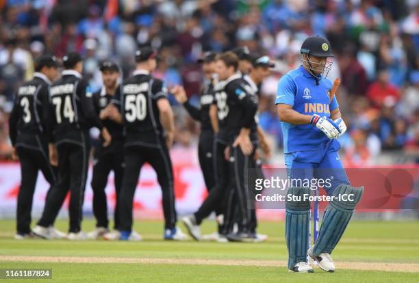 Dhoni of India walks off after being dismissed during the Semi-Final match of the ICC Cricket World Cup 2019 between India and New Zealand at Old...