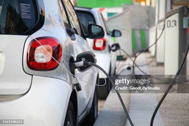 electric cars charging - station service france stock pictures, royalty-free photos & images
