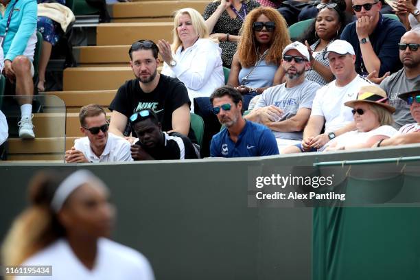 Serena Williams player box looks on during the Mixed Doubles third round match between Serena Williams of the United States, Andy Murray of Great...