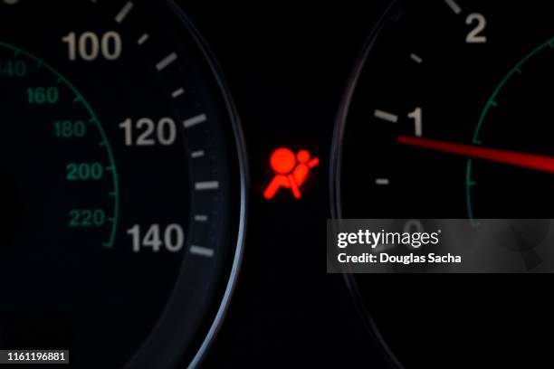 close-up of an illuminated air bag warning light - airbag stockfoto's en -beelden