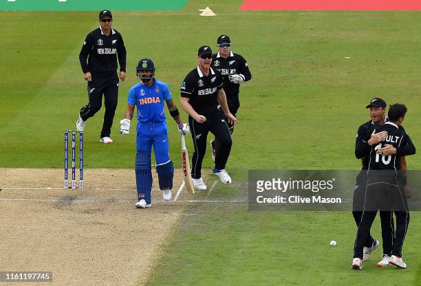 Trent Boult of New Zealand appeals successfully for the wicket of Virat Kohli of India during the Semi-Final match of the ICC Cricket World Cup 2019...