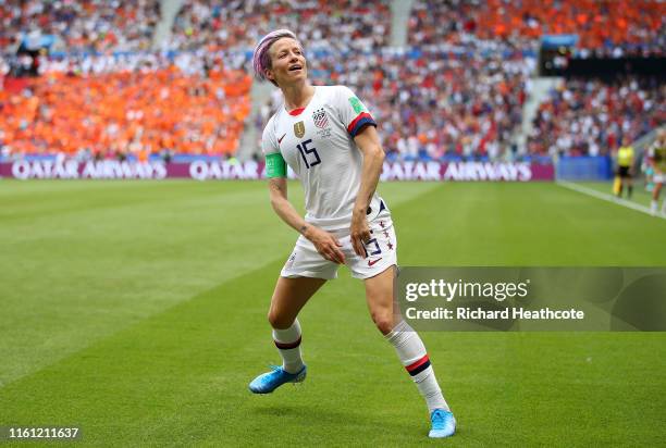 Megan Rapinoe of the USA celebrates scoring the first goal from the penalty spot during the 2019 FIFA Women's World Cup France Final match between...