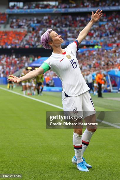 Megan Rapinoe of the USA celebrates scoring the first goal from the penalty spot during the 2019 FIFA Women's World Cup France Final match between...