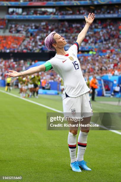 Megan Rapinoe of the USA celebrates scoring the first goal from the penalty spot during the 2019 FIFA Women's World Cup France Final match between...