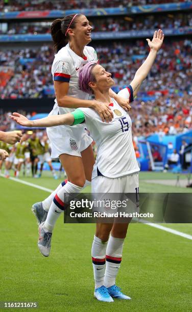 Megan Rapinoe of the USA celebrates scoring the first goal from the penalty spot with Alex Morgan during the 2019 FIFA Women's World Cup France Final...