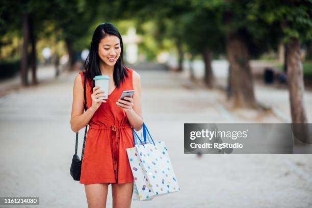 girl using smart phone - girl after shopping stock pictures, royalty-free photos & images