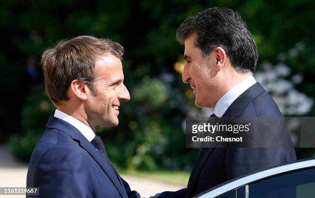 French President Emmanuel Macron welcomes Prime Minister of the Kurdistan Regional Government Nechirvan Barzani prior to their meeting at the Elysee...