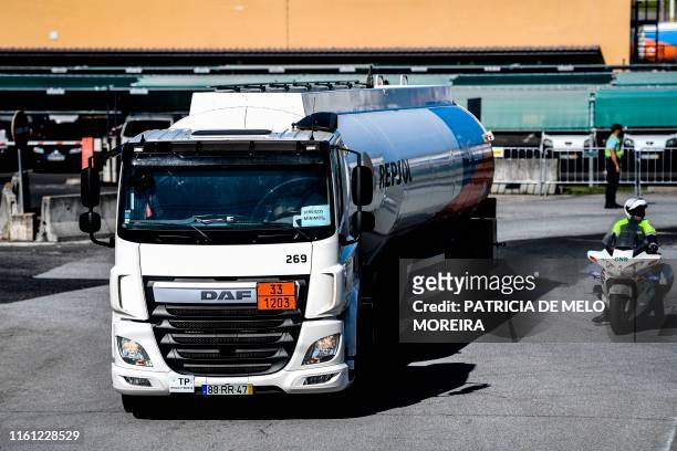 Police escorts fuel-tankers leaving CLC in Aveiras de Cima during the first day of a fuel truck drivers strike on August 12, 2019. - Portuguese...