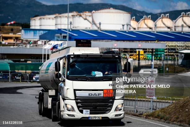 Minimum service fuel-tanker leaves CLC in Aveiras de Cima during the first day of a fuel truck drivers strike on August 12, 2019. - Portuguese police...