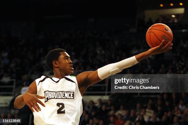 Marshon Brooks of the Providence Friars drives for a shot attempt against the Rhode Island Rams at the Dunkin' Donuts Center on December 4, 2010 in...