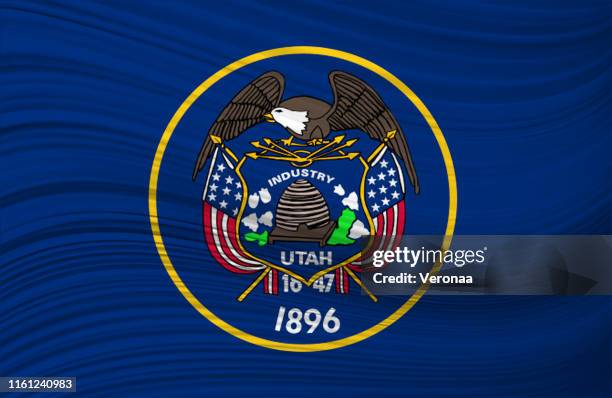 waving flag of utah in united states. - utah state flag stock illustrations