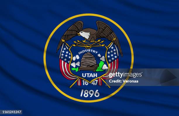 waving flag of utah in united states. - utah state flag stock illustrations
