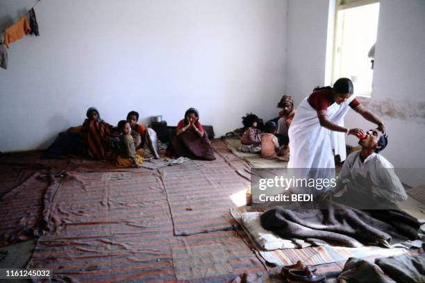 Victims of the Bhopal tragedy wait to be treated on December 15, 1984 at Bhopal's hospital where a poison gas leak from the Union Carbide factory...