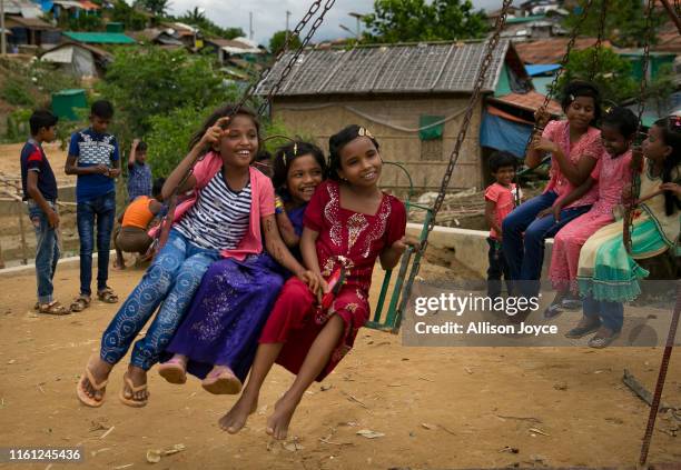 Rohingya Muslims celebrate at a fair during Eid al-Adha in a refugee camp August 12, 2019 in Cox's Bazar, Bangladesh. Eid al-Adha, or the Festival of...