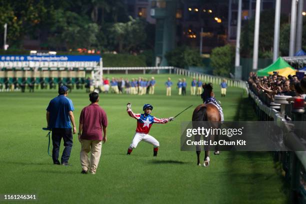 Horse Master Bernini running on the track, its rider Umberto Rispoli, being dislodged before the Race 2 Street Cat Handicap at Happy Valley...