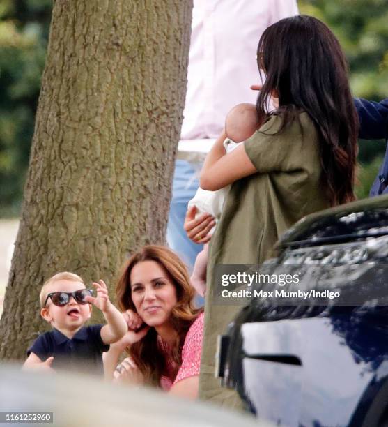 Prince Louis of Cambridge, Catherine, Duchess of Cambridge, Meghan, Duchess of Sussex and Archie Harrison Mountbatten-Windsor attend the King Power...