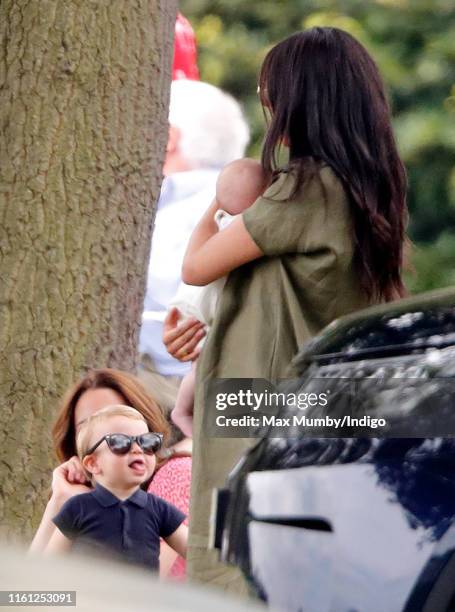 Prince Louis of Cambridge, Catherine, Duchess of Cambridge, Meghan, Duchess of Sussex and Archie Harrison Mountbatten-Windsor attend the King Power...