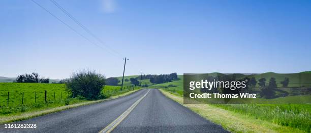 driving on a country road - country road stock pictures, royalty-free photos & images