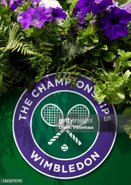 The Wimbledon logo amongst flowers during Day Nine of The Championships - Wimbledon 2019 at All England Lawn Tennis and Croquet Club on July 10, 2019...