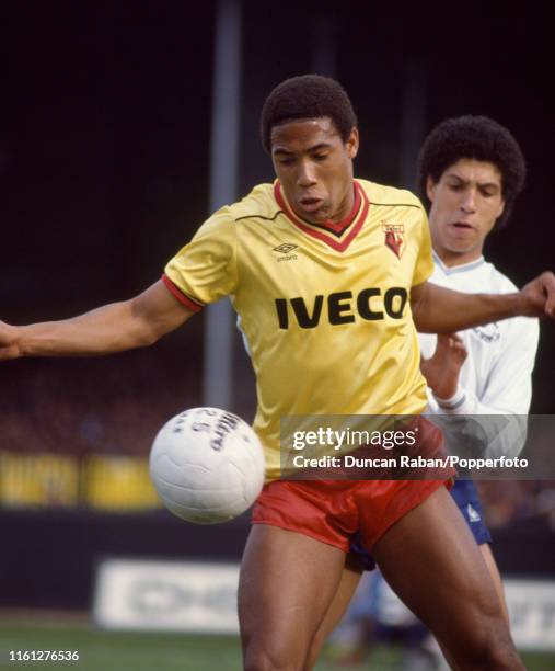 John Barnes of Watford shields the ball from Chris Hughton of Tottenham Hotspur during a Football League Division One match at Vicarage Road on March...