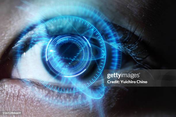 human eye with using the futuristic technology - iris scan stock pictures, royalty-free photos & images