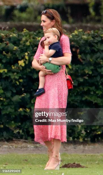 Catherine and Duchess of Cambridge and Prince Louis of Cambridge attend the King Power Royal Charity Polo Match, in which Prince William, Duke of...