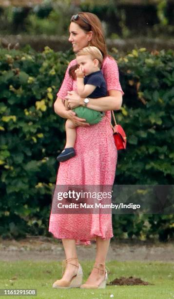 Catherine and Duchess of Cambridge and Prince Louis of Cambridge attend the King Power Royal Charity Polo Match, in which Prince William, Duke of...