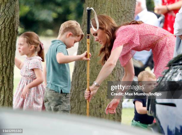 Princess Charlotte of Cambridge, Prince George of Cambridge, Catherine, Duchess of Cambridge and Prince Louis of Cambridge attend the King Power...