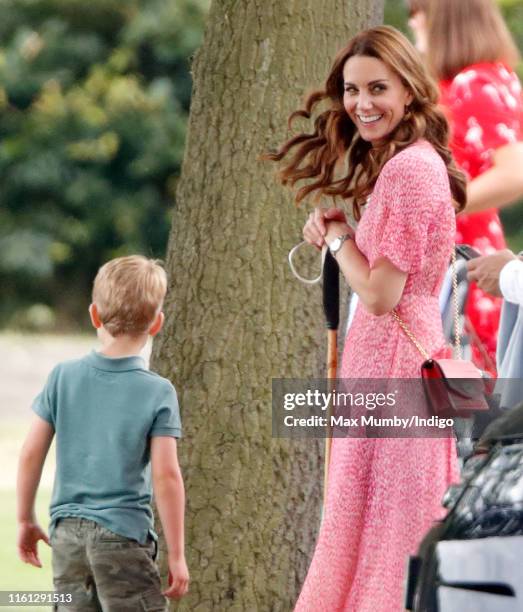 Prince George of Cambridge, Catherine and Duchess of Cambridge attend the King Power Royal Charity Polo Match, in which Prince William, Duke of...