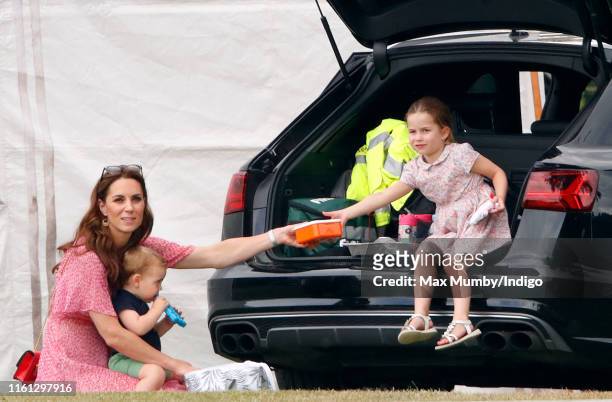 Catherine, Duchess of Cambridge, Prince Louis of Cambridge and Princess Charlotte of Cambridge attend the King Power Royal Charity Polo Match, in...