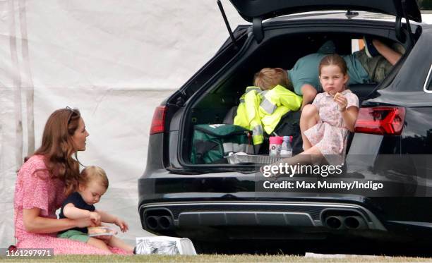 Catherine, Duchess of Cambridge, Prince Louis of Cambridge, Princess Charlotte of Cambridge and Prince George of Cambridge attend the King Power...