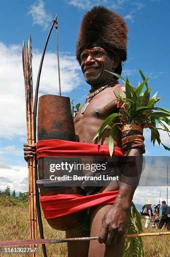 Tribesman wearing huge koteka in Wamena - West Papua Tribesman wearing huge koteka in Wamena - West Papua