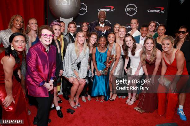 Billie Jean King and Bill Russell with members of the United States Women's National Soccer Team, winners of the Best Team award, pose during The...