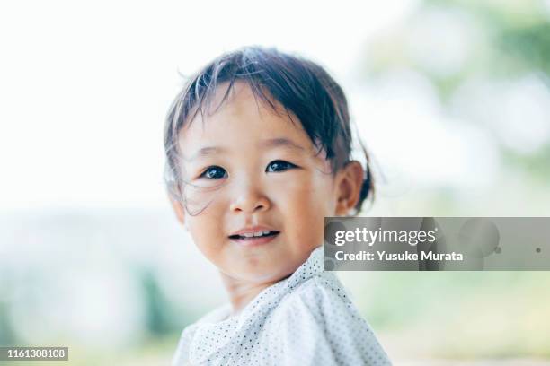 portrait of little girl with smiling - 清らか ストックフォトと画像