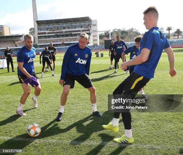 Luke Shaw, Phil Jones and Scott McTominay of Manchester United in action during a first team training session as part of their pre-season tour of...
