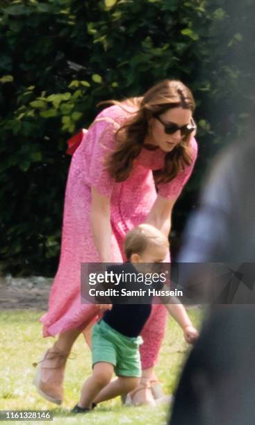 Catherine, Duchess of Cambridge and Prince Louis attend The King Power Royal Charity Polo Day at Billingbear Polo Club on July 10, 2019 in Wokingham,...