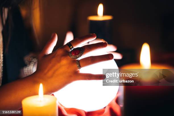 fortune teller and crystal sphere - fire ring stock pictures, royalty-free photos & images