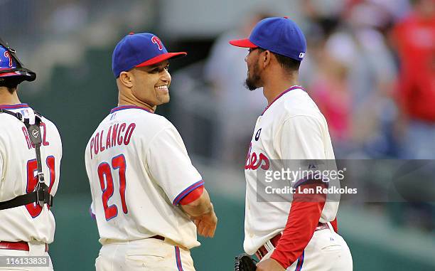Antonio Bastardo and Placido Polanco of the Philadelphia Phillies celebrate a 7-1 win against the Chicago Cubs at Citizens Bank Park on June 11, 2011...