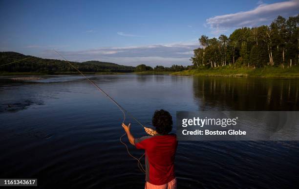 Gill Walker casts his line into the Allagash River after arriving on the shores of Evelyn's Field in the small community of Allagash, ME on Aug. 1,...