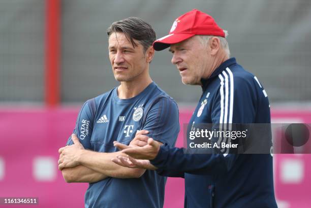 Team coach Niko Kovac of FC Bayern Muenchen talks to Hermann Gerland during a training session at the club's Saebener Strasse training ground on July...