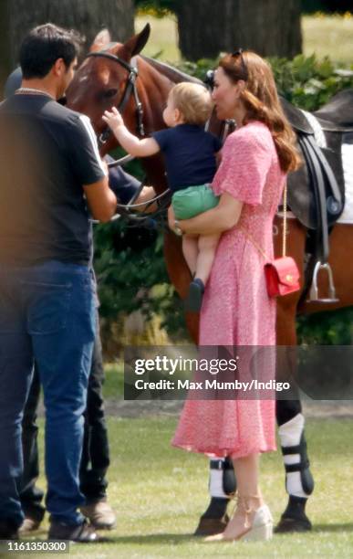 Catherine, Duchess of Cambridge and Prince Louis of Cambridge attend the King Power Royal Charity Polo Match, in which Prince William, Duke of...