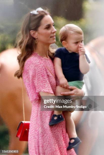 Catherine, Duchess of Cambridge and Prince Louis of Cambridge attend the King Power Royal Charity Polo Match, in which Prince William, Duke of...