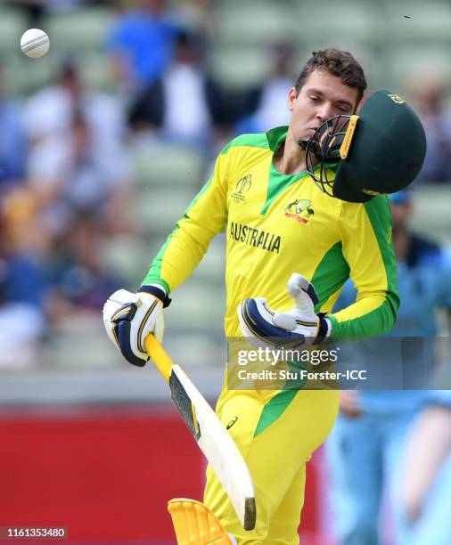 Alex Carey of Australia is hit by a bouncer from Jofra Archer of England during the Semi-Final match of the ICC Cricket World Cup 2019 between...