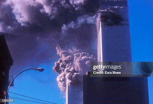 One of the World Trade Center's twin towers collapses after it was struck by a commerical airliner in a suspected terrorist attack September 11, 2001...
