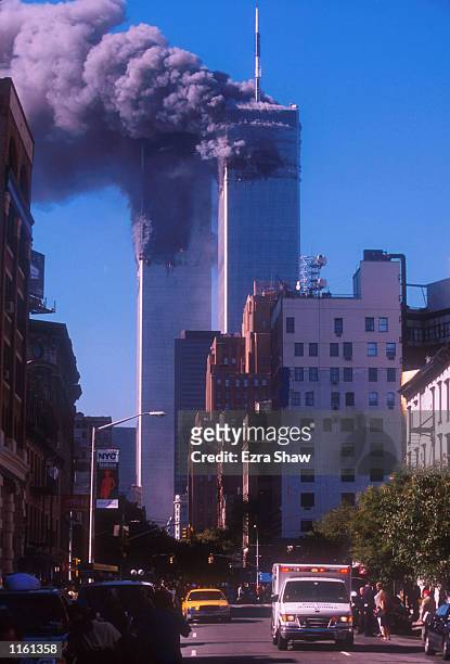 Smoke billows from the World Trade Center's twin towers after they were struck by commerical airliners in a suspected terrorist attack September 11,...