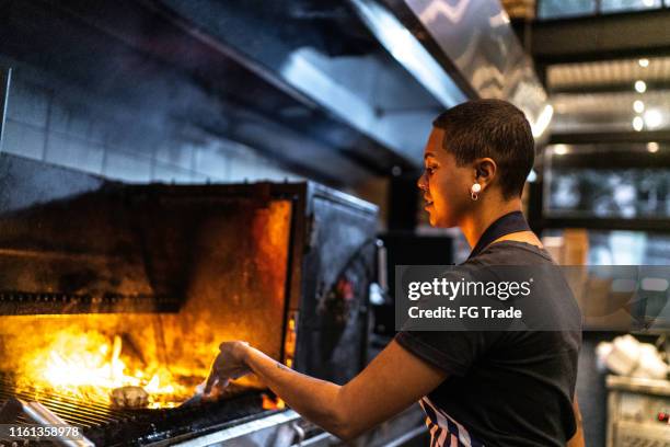 chef preparing hamburguer - restaurant fire stock pictures, royalty-free photos & images