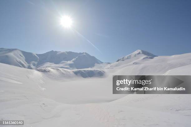 tateyama mountains - snowcapped mountain stock pictures, royalty-free photos & images