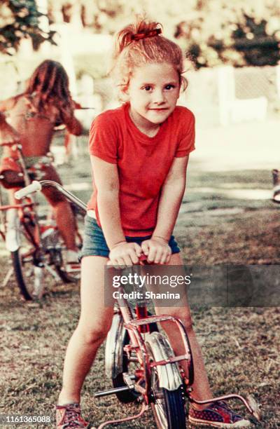 vintage girl on a bike - bicicleta vintage imagens e fotografias de stock